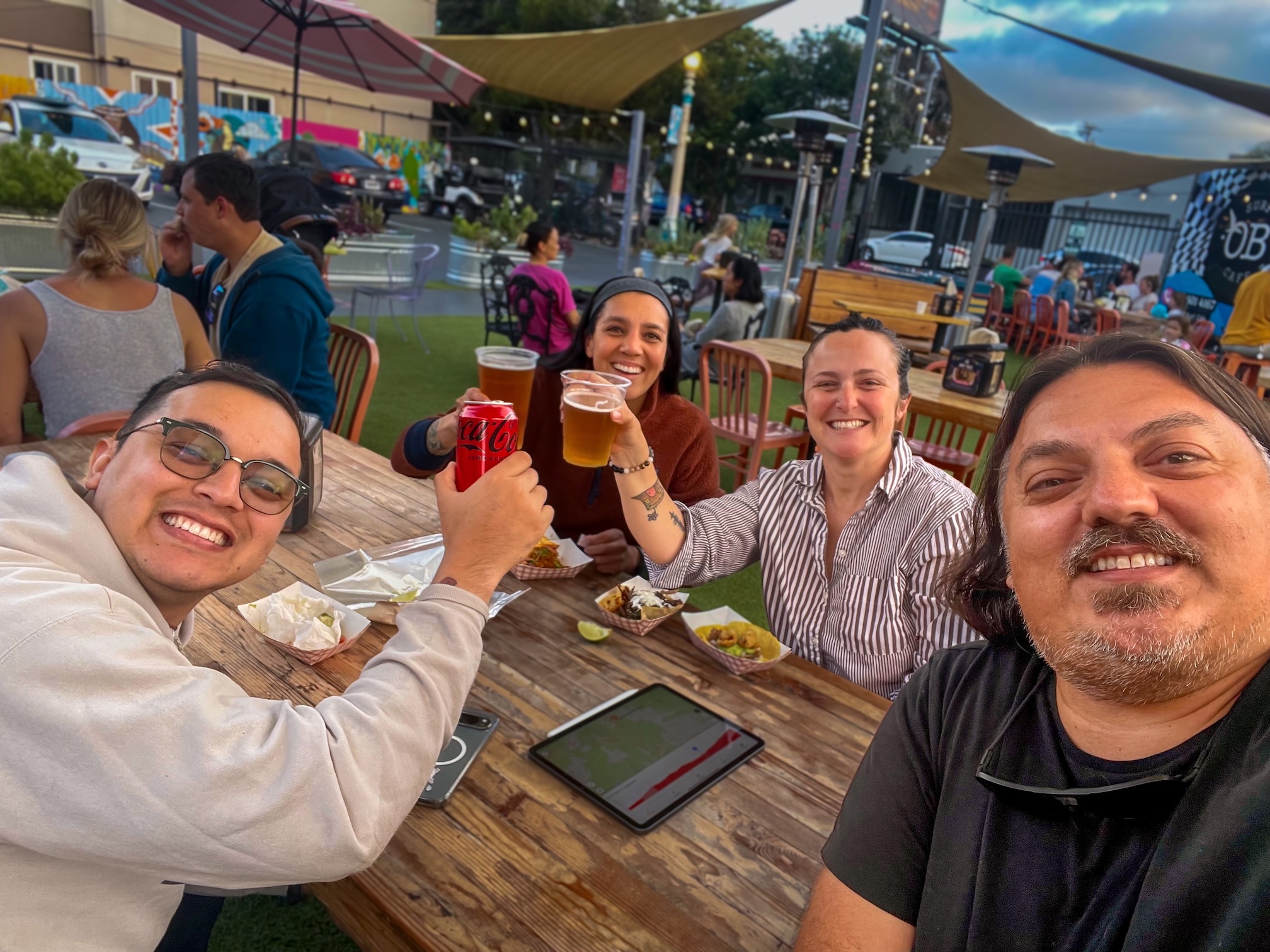 4 person planning team toasting a solid ride plan